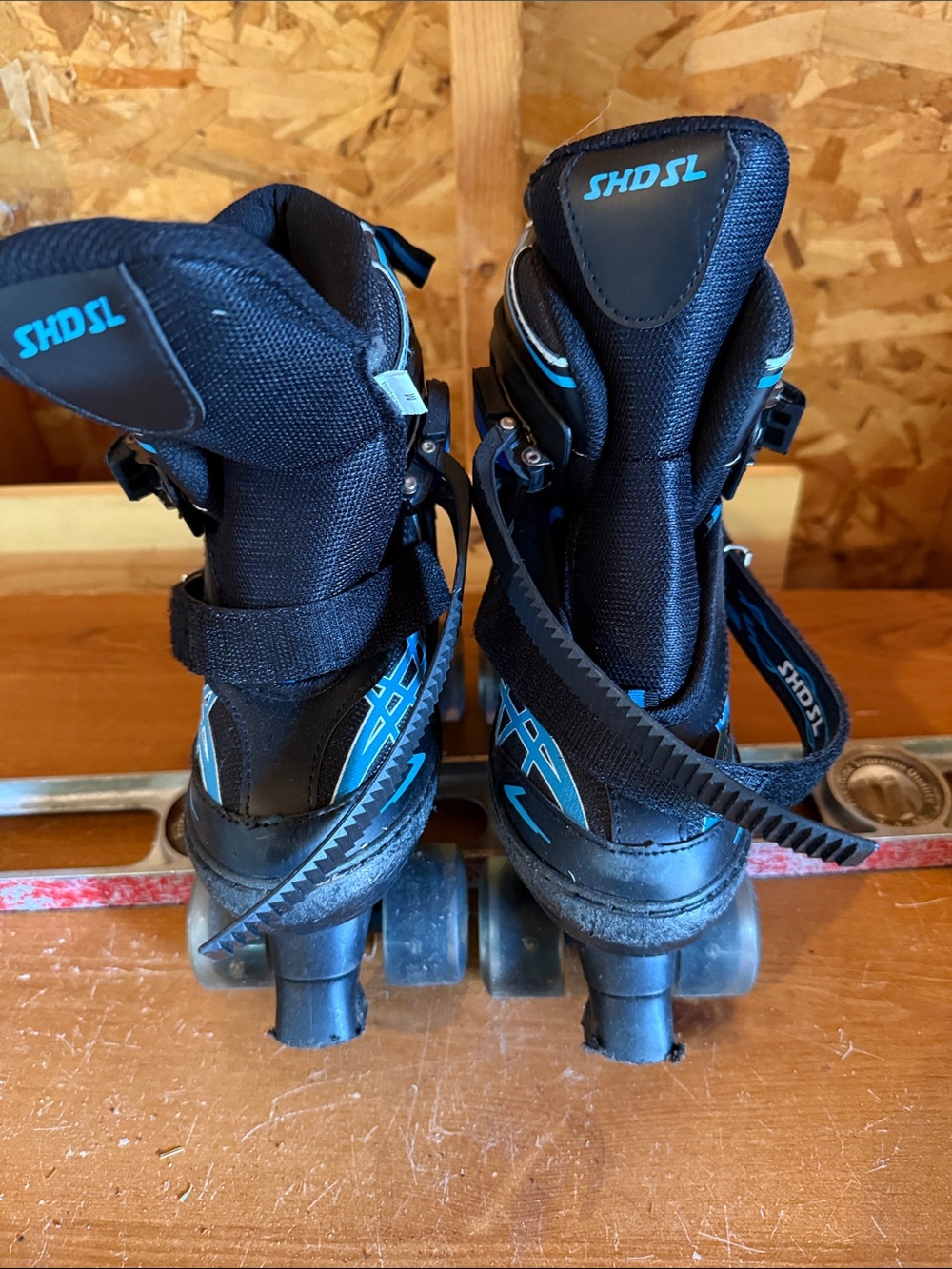 Black and Blue Quad Roller Skates with Strap Closure